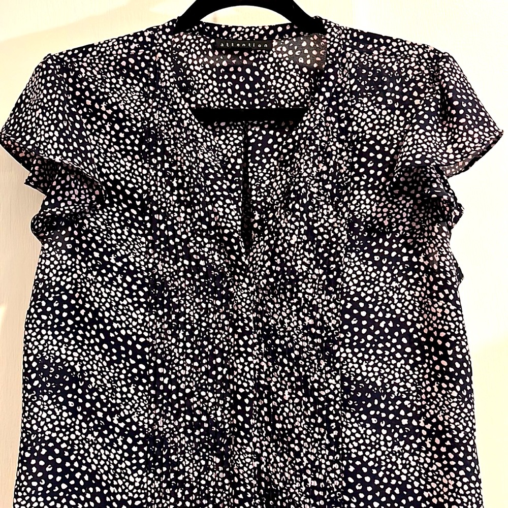 Attention blouse with front flattering fan folds and ruffled sleeves